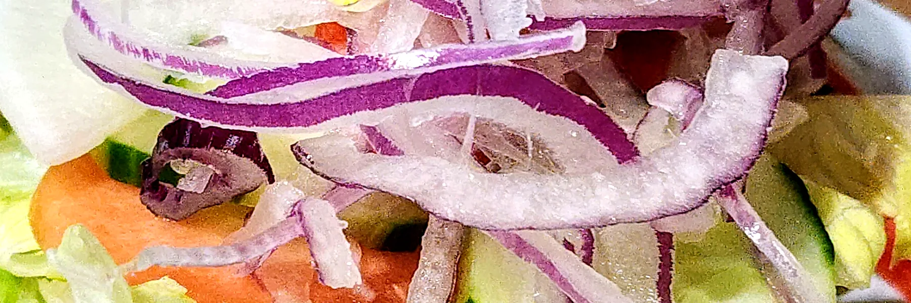 Fresh garden salad with red onion rings